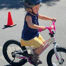 Little Girl Smiling on a Bike
